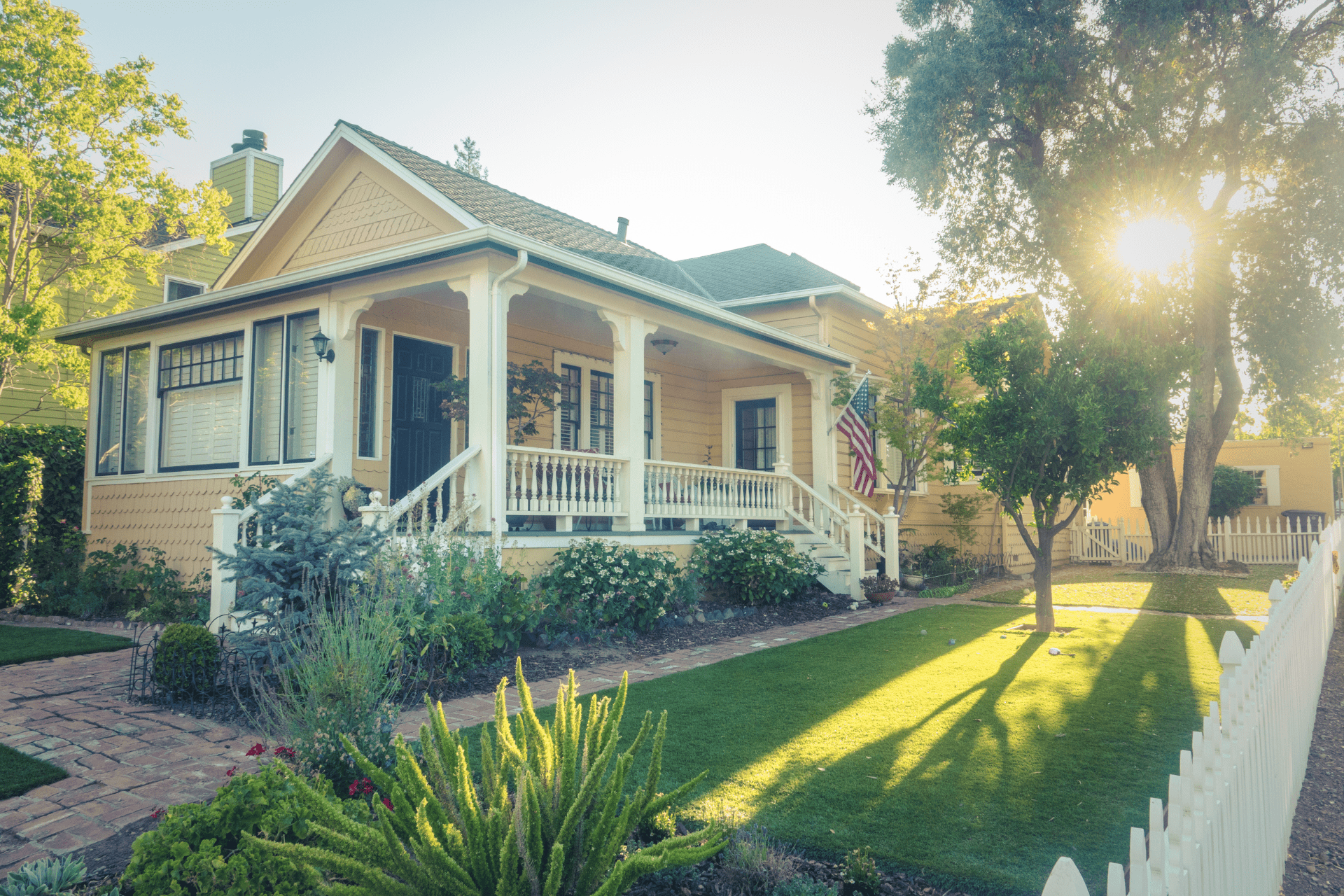 Exterior of a yellow house with a porch. Our DP-1 policy is an excellent option for Florida property owners and landlords. 